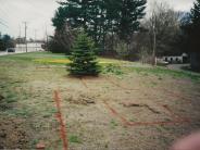 Green grass with orange outline of varied shape as to where the firefighters memorial will be.