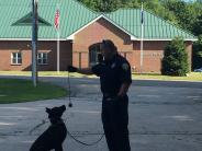 Officer Donahue conducting obedience demonstration with K9 Ice