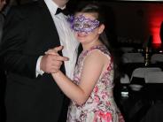 dad in a tux dancing with daughter