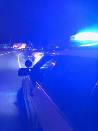 HPD Officer condutcing a motor vehicle stop at night