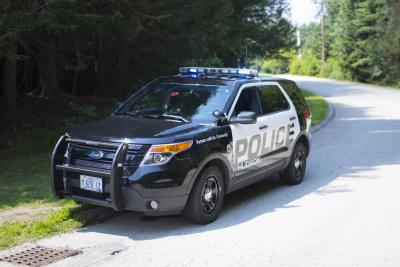 Fully Marked Police Cruiser parked on side of the road